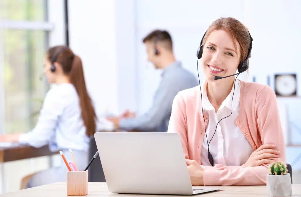 CRM virtual assistant handling lead follow-ups on a call from her desk