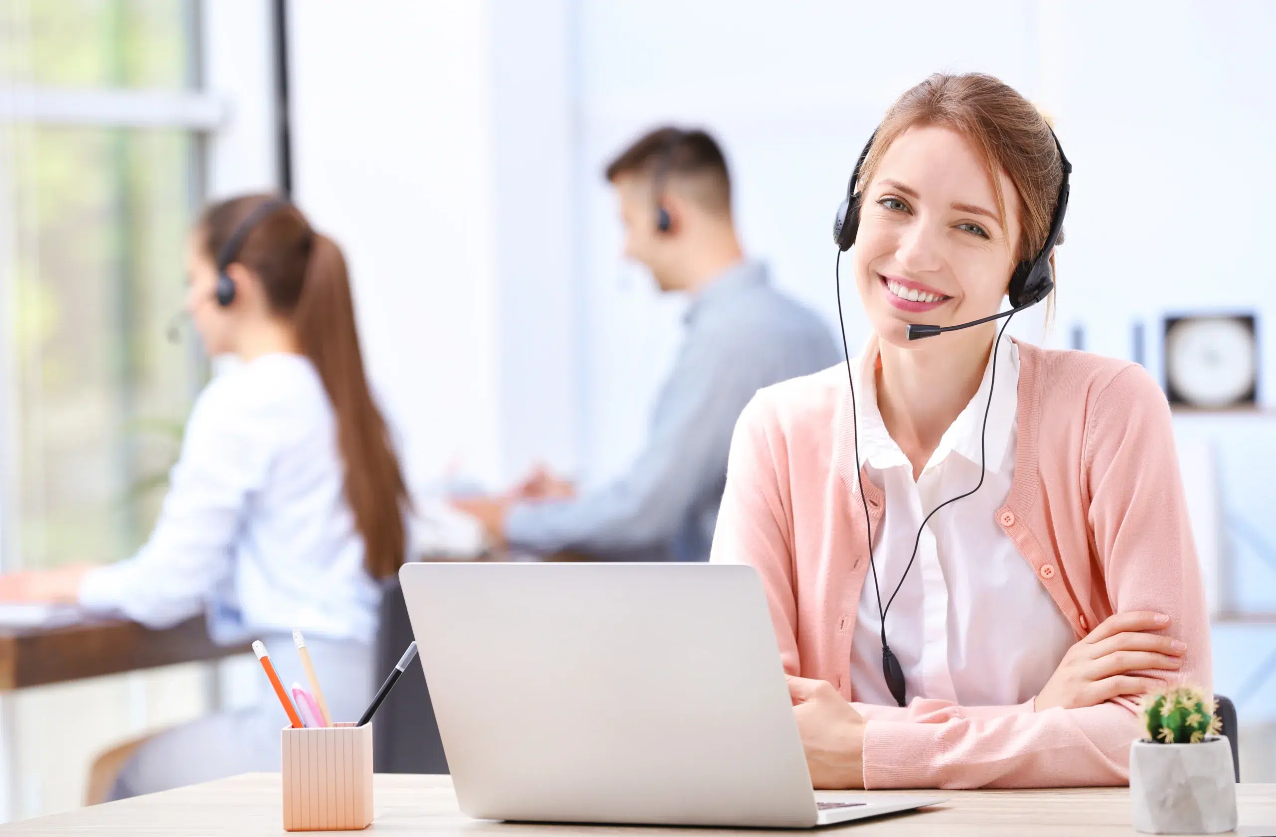 CRM virtual assistant handling lead follow-ups on a call from her desk